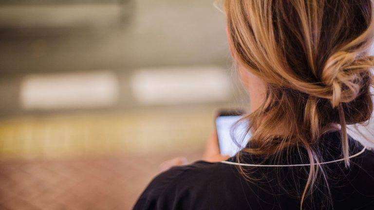 woman-reading-text-message-on-phone
