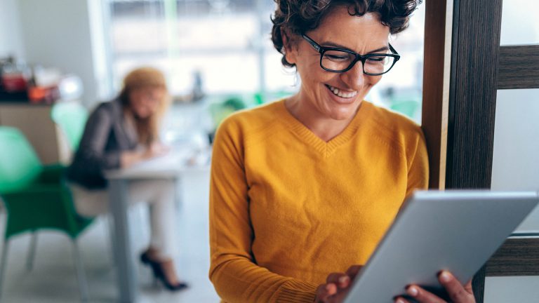 photo tall business woman tablet smiling research