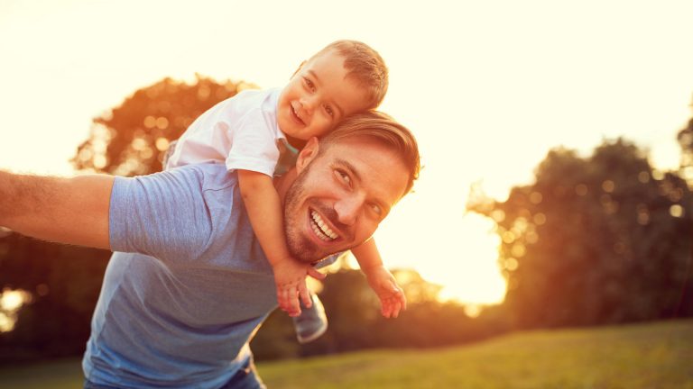 photo tall young dad son piggyback sun