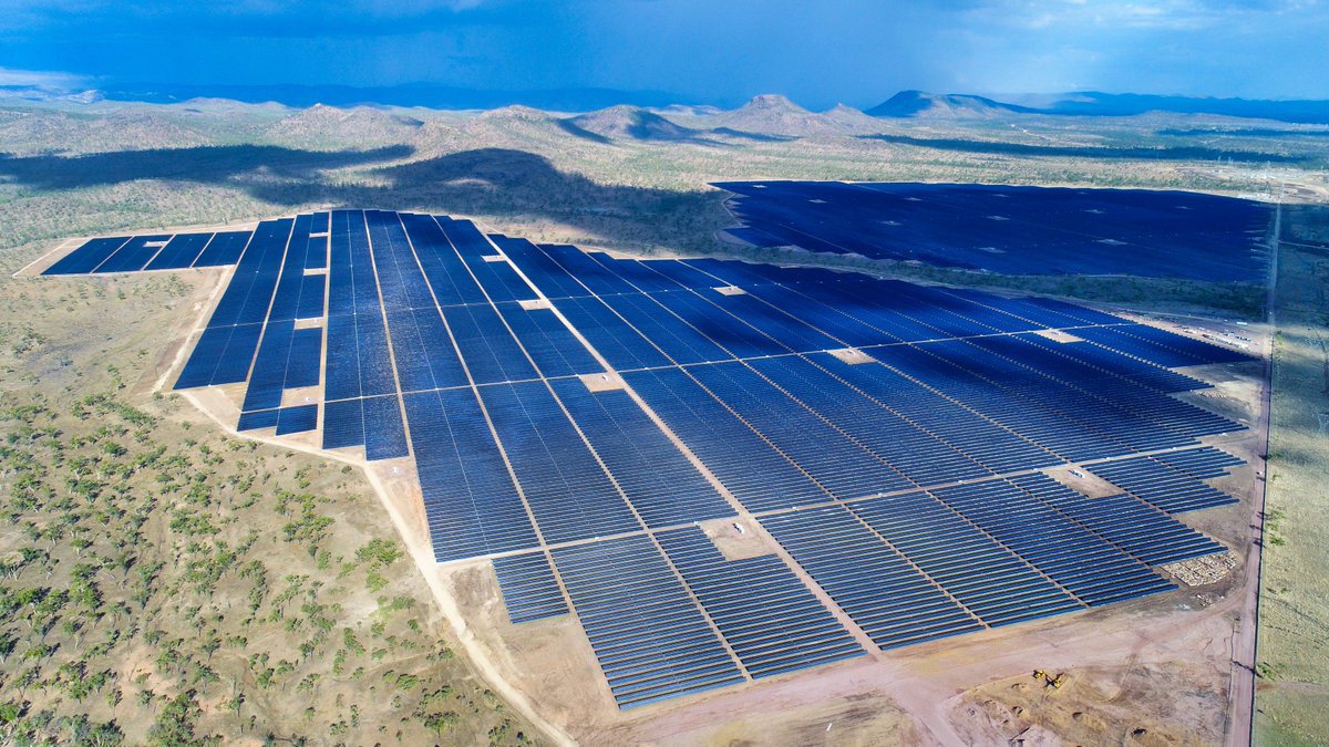 Image shows a large scale solar farm from the sky.