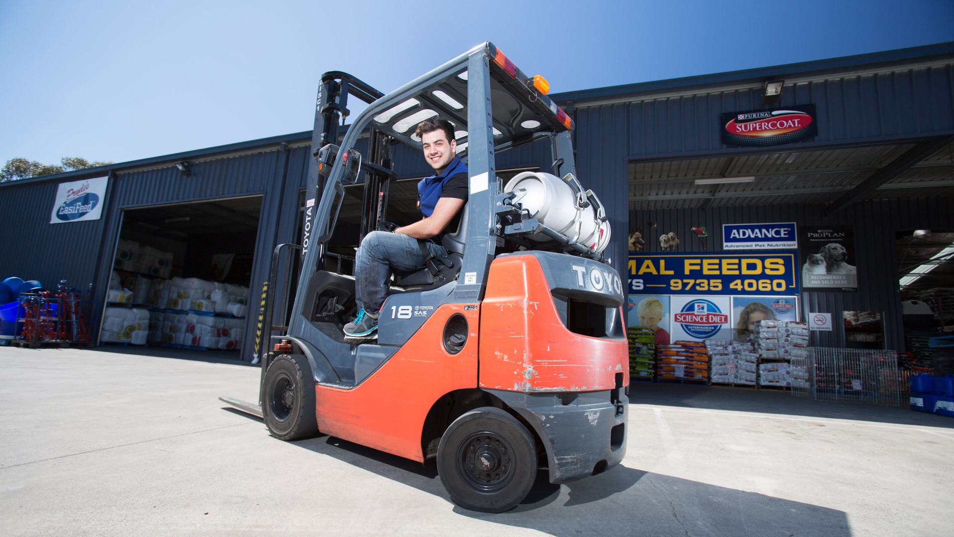 man-sitting-on-gas-forklift