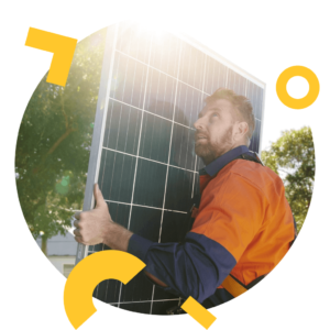 Solar technician carrying solar panel